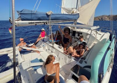 aft deck from blissy with relaxing and sunbathing group